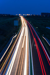 Long exposure photo of traffic on the move at dusk..
