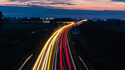 Long exposure photo of traffic on the move at dusk..