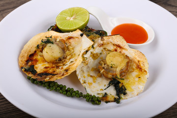 Baked scallops with spinach