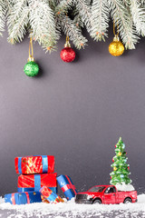 Christmas tree on toy Red Truck car on snow, balls christmas tree branches. Christmas holiday celebration concept
