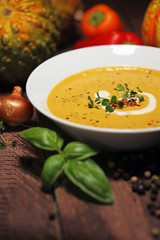 Pumpkin soup on a wooden table