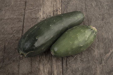 cucumbers on wooden table