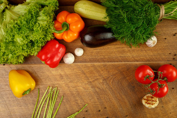 wooden background with vegetables and spices
