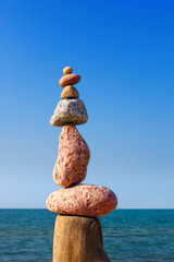 Balance and poise stones. Rock zen on the background of blue sky