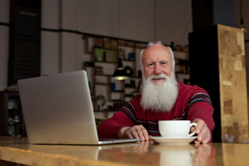 old man with a laptop