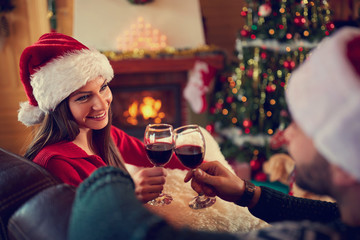 Couple toasting with red wine