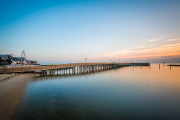 Long exposure of the pier and Chesapeake Bay at sunrise, in Nort