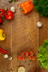 wooden background with vegetables and spices
