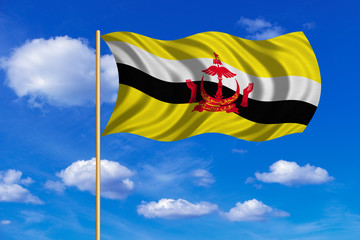 Flag of Brunei waving on blue sky background