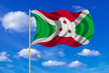 Flag of Burundi waving on blue sky background