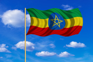 Flag of Ethiopia waving on blue sky background
