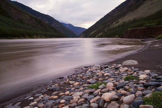 Muddy mountain river with long exposure. Indigirka River. Yakutia. Russia.