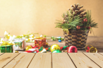 Christmas and new year blurring background with , gift box, daisy flower, candy ball and decoration moc up  Perspective brown wood ove on vintage background.