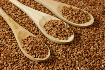 buckwheat groats and wooden spoon