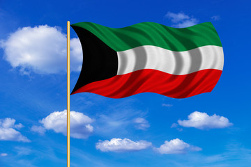 Flag of Kuwait waving on blue sky background