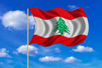 Flag of Lebanon waving on blue sky background