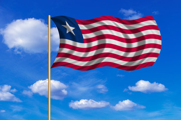 Flag of Liberia waving on blue sky background