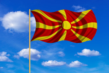 Flag of Macedonia waving on blue sky background
