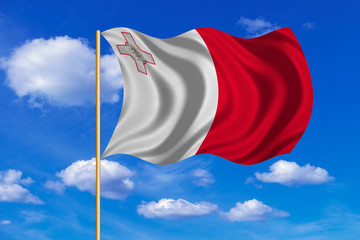 Flag of Malta waving on blue sky background