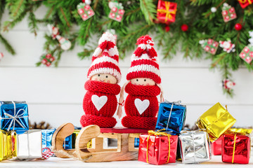 Christmas composition with Christmas fir tree branch and gnomes.