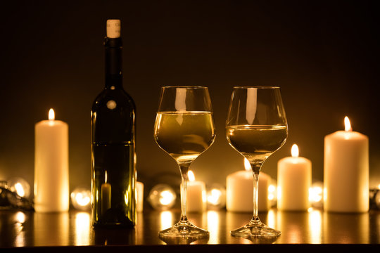 Bottle of white wine with glasses