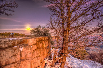 Sunlight and moonset coexist at Grandview Point in hte Grand Canyon 