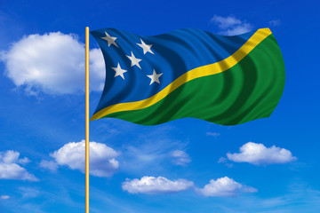 Flag of Solomon Islands wavy on blue sky backdrop