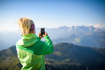 Young women taking a selfie, Austrian mountains