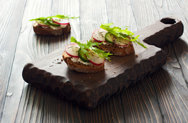 Toasts with radish and cucumber