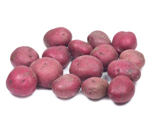 Ripe organic red potatoes on white background