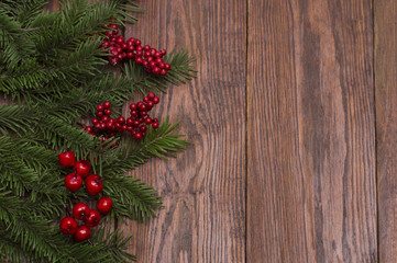 Christmas fir tree on wooden background