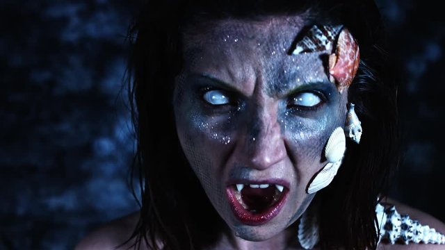 4k Halloween Shot of a Horror Woman Mermaid Grinning Vampire Teeth