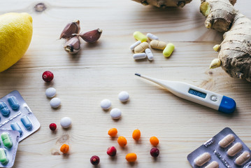 Natural and synthetic drugs on the wooden table . Health concept, traditional medicine and ethnoscience.