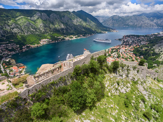 Fototapeta na wymiar Rear view at the walls and ruins of castle St. John (San Giovanni) on top hill. Gulf of Kotor. View from drone. Montenegro