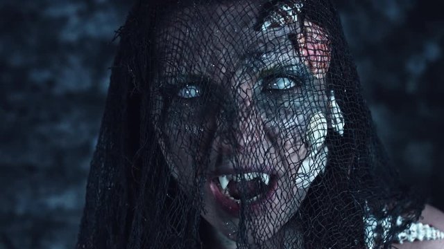 4k Halloween Shot of a Horror Woman Mermaid Grinning Vampire Teeth