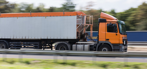 construction work truck on highway speed blur