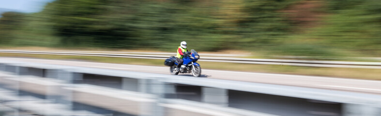 Obraz na płótnie Canvas motorcycle on highway speed blur