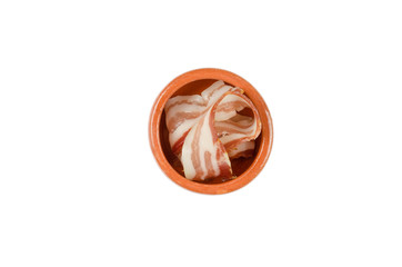 thinly chopped bacon in a decorative bowl or cup