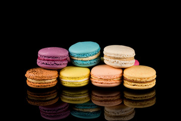 Colorful macaroon over black background