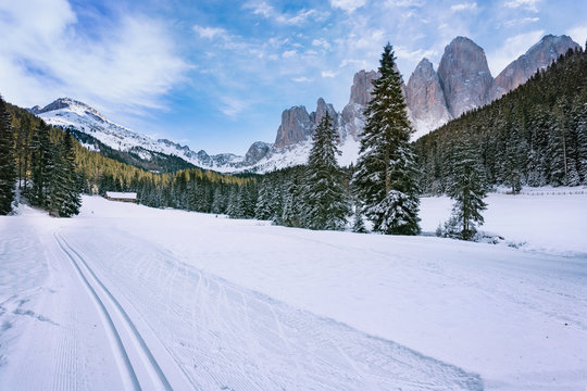 Winter views of the Geisler or Odle Dolomites mountain peaks in the Val di Funes (Villnosstal) in Italy. The surroundings of the village Santa Maddalena. Beautiful places for nordic ski.