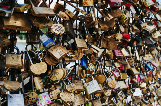 PARIS - JUNE 26: Love lockers at Pon des Arts bridge across Seine river. They symbolize love for ever.