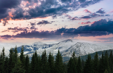 Landscape of fantastic sunset in the winter mountains . Dramatic evening sky.