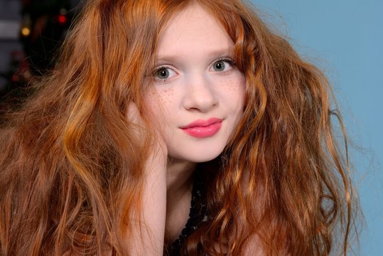 portrait of a redhead girl with beautiful flowing hair