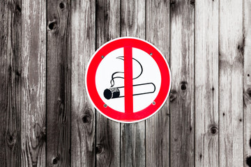 No smoking sign on wooden door
