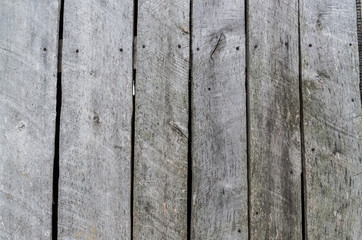 Dark gray weathered rustic wooden barn wall timber planks closeup texture background. Empty sapce for text, lettering, copy.