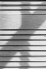 White wooden shutters interesting unusual abstract closeup texture with shadow