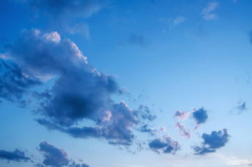 Abstract blue sky, yellow, red, orange clouds empty background