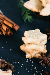Star shaped cookies with cinnamon and anise on the table