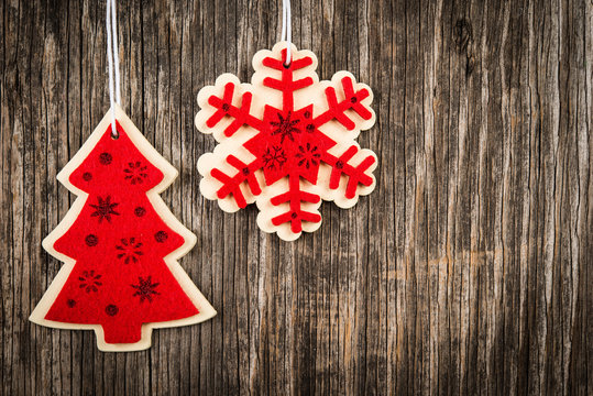 Red colored Christmas tree and snowflake decorations