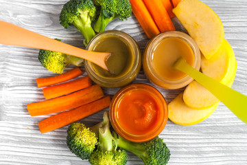 baby vegetable puree on wooden background top view